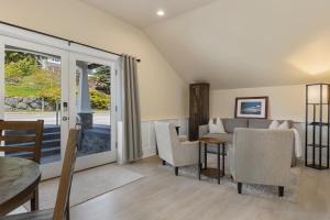 a living room with a couch and a table at Waterfront Inn in Gig Harbor