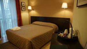 Posteľ alebo postele v izbe v ubytovaní HOTEL DEL CORSO