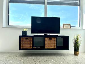 A television and/or entertainment centre at Chic&cozy with Sauna