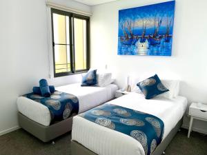 A bed or beds in a room at Absolute Waterfront - Tropical Oasis Over The Water