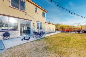 a patio with a table and chairs in a yard at Festival and Family Fun Permit# 50369 in Indio
