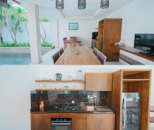 a kitchen with a sink and a stove top oven at Odika Lovina Villas in Lovina