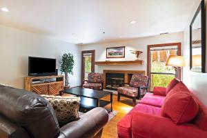 a living room with a couch and a table at Stunning Location 2BDR Condo Retreat in Park City