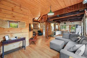 a living room with a couch and a table at Blerick Country Retreat in Neerim South