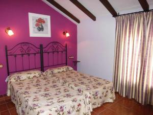 Łóżko lub łóżka w pokoju w obiekcie Apartamentos Trinidad