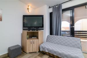 A television and/or entertainment centre at Apartment Premantura 2228a