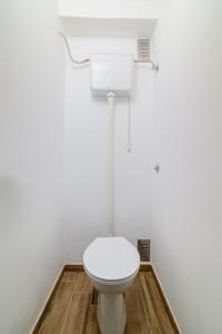 a bathroom with a white toilet in a room at Apartment Premantura 2228a in Premantura