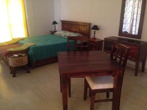 Ένα ή περισσότερα κρεβάτια σε δωμάτιο στο Studio and One bedroom Apartment in Riviera Sapphire, Siolim