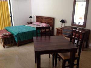 Ένα ή περισσότερα κρεβάτια σε δωμάτιο στο Studio and One bedroom Apartment in Riviera Sapphire, Siolim