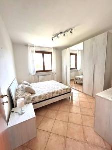 a bedroom with a large bed in a room at Dimora del Viaggiatore in Marina di Carrara