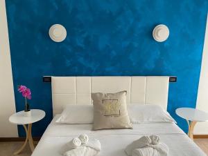Postel nebo postele na pokoji v ubytování Hotel Hc Resort Lignano