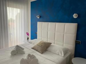 Postel nebo postele na pokoji v ubytování Hotel Hc Resort Lignano