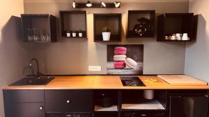 a kitchen with a wooden counter top in a room at Lounge Apartment Orti in Udine