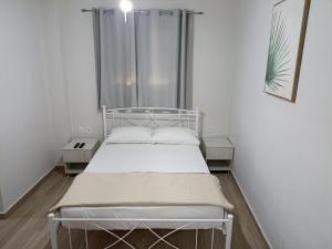 Postel nebo postele na pokoji v ubytování palm-tree