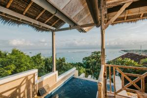 a view of a swimming pool from a house at Villa Lanie Lembongan in Nusa Lembongan
