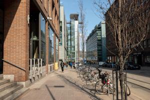 a group of bikes parked on a city street at 2ndhomes Stylish 1BR home with Balcony and Sauna in Kamppi Center in Helsinki