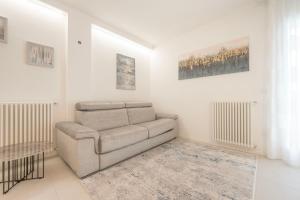 a living room with a couch and a table at Residence Luxury Elisabeth in Caorle