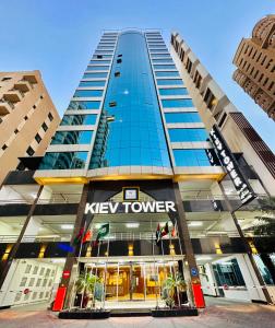 a large building with a key tower at Kiev Tower Hotel Apartments in Manama