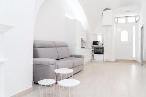 a living room with a couch and two tables at Apartment - White Place - Affitti Brevi Italia in Manfredonia