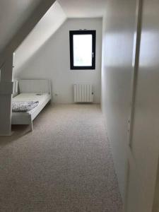 Łóżko lub łóżka w pokoju w obiekcie Villa vue exceptionnelle sur le Cap Gris-Nez