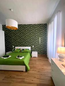 A bed or beds in a room at I MORI G&G