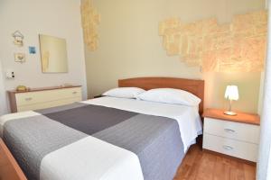Voodi või voodid majutusasutuse La Terrazza sul Porto toas