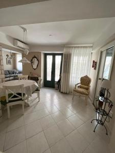 a dining room and living room with a table and chairs at Apartment Sulle scale in Piran