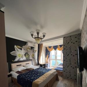 Ένα ή περισσότερα κρεβάτια σε δωμάτιο στο Гостевой дом Марина