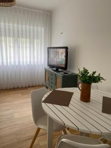 TV a/nebo společenská místnost v ubytování Apartamento da Bandeira