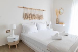 מיטה או מיטות בחדר ב-White Dream House