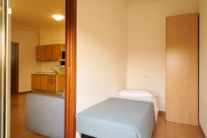 Postel nebo postele na pokoji v ubytování Aparthotel La Pineta