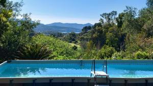 a swimming pool with a view of the mountains at Villa Podere I Cavalieri in SantʼAnna