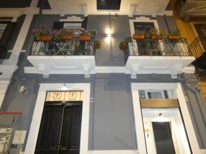 a building with potted plants on the balconies at CASA SIMONETTA in Bari
