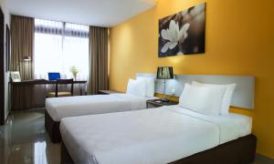 Postel nebo postele na pokoji v ubytování Fahrenheit Suites Bukit Bintang, Kuala Lumpur