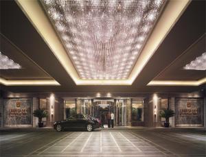 a rendering of a building with a car in front at Shangri-La Dalian in Dalian