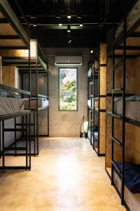 a room with several bunk beds and a window at COOLFREEDIVING Hostel in Green Island