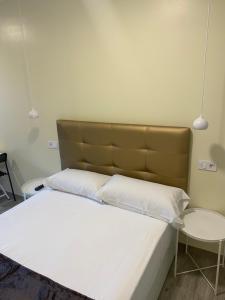 Postel nebo postele na pokoji v ubytování Hostal Oliver