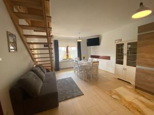 a living room with a couch and a table at Domki JAWOR in Zakopane