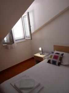 Posteľ alebo postele v izbe v ubytovaní Apartments city center M&M