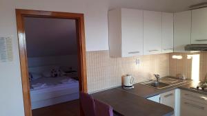 Kuchyňa alebo kuchynka v ubytovaní Apartments city center M&M