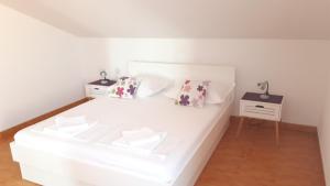 Posteľ alebo postele v izbe v ubytovaní Apartments city center M&M