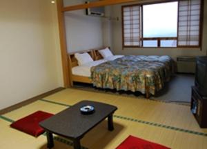 Postel nebo postele na pokoji v ubytování Star Hotel Akakura + 37 fotografií