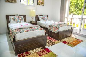 מיטה או מיטות בחדר ב-Island Charm of Praslin