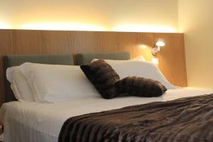 Rúm í herbergi á Hotel Abetaia