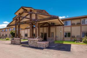 a building with a pavilion in front of a building at Rodeway Inn in Colorado Springs