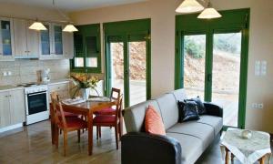 a living room with a couch and a table at Porto Katsiki Blu in Athani