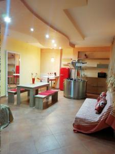 a room with a kitchen with a table and a counter at Sole&Mare in Monopoli