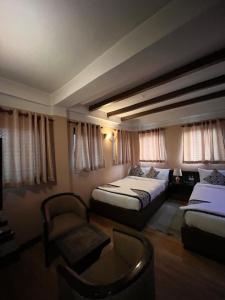 Postel nebo postele na pokoji v ubytování Hotel Garuda