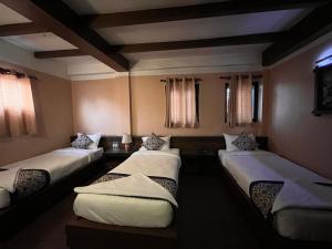 Postel nebo postele na pokoji v ubytování Hotel Garuda