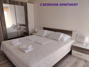 Ένα ή περισσότερα κρεβάτια σε δωμάτιο στο Apartments Miraflor, city center